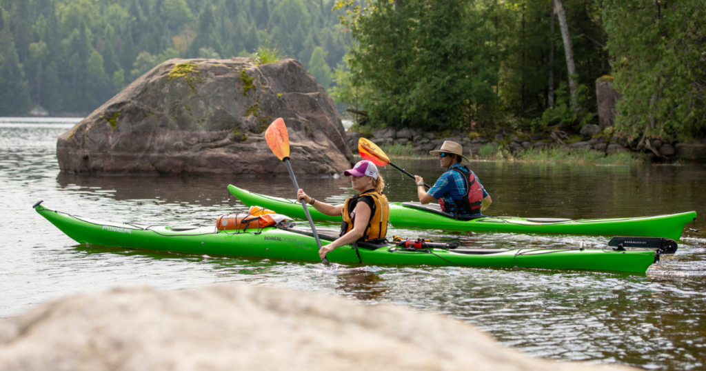 ken whiting and tour guide kayaking in les Laurentides, Québec paddle tales paddletv facing waves
