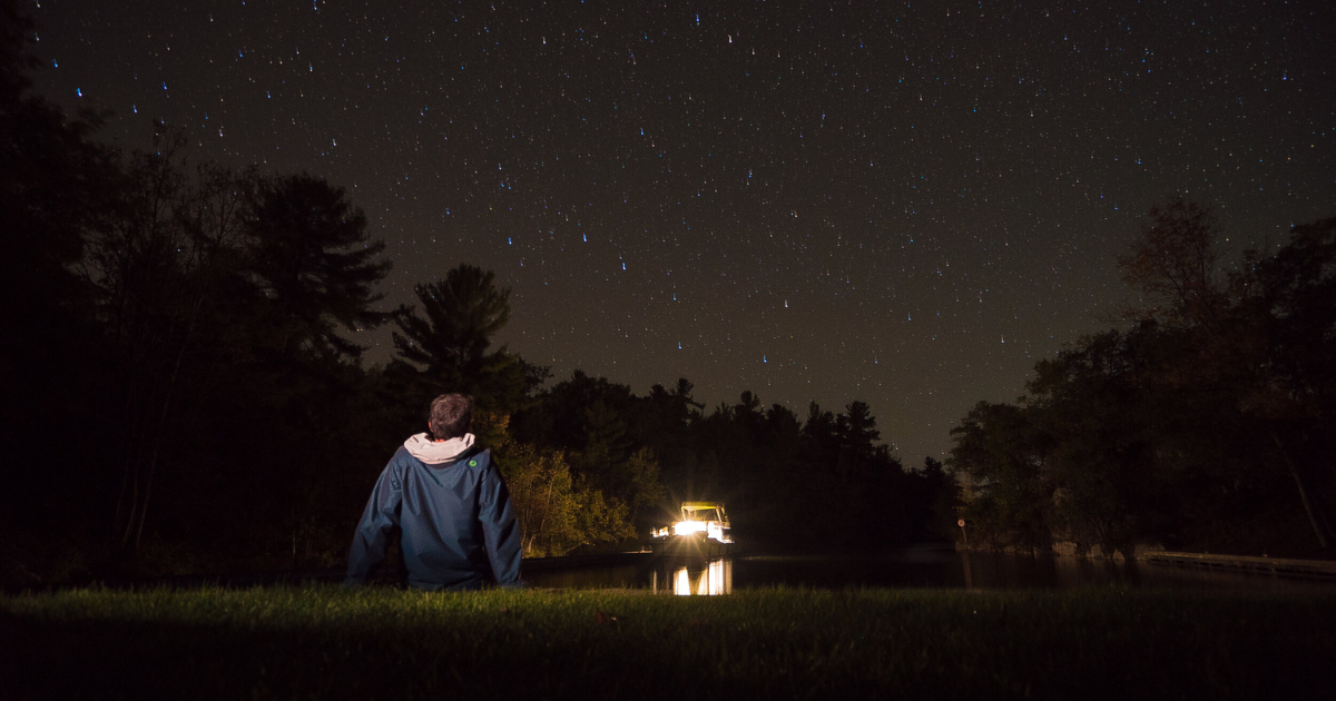 ken looking at the starry night sky in the rideau canal