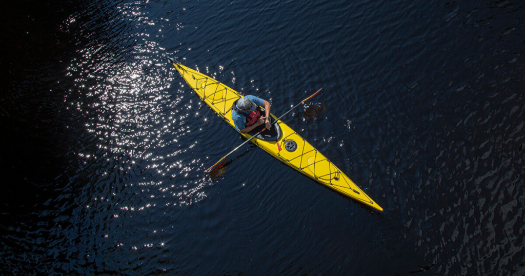 ken whiting using a sit inside kayak on the water