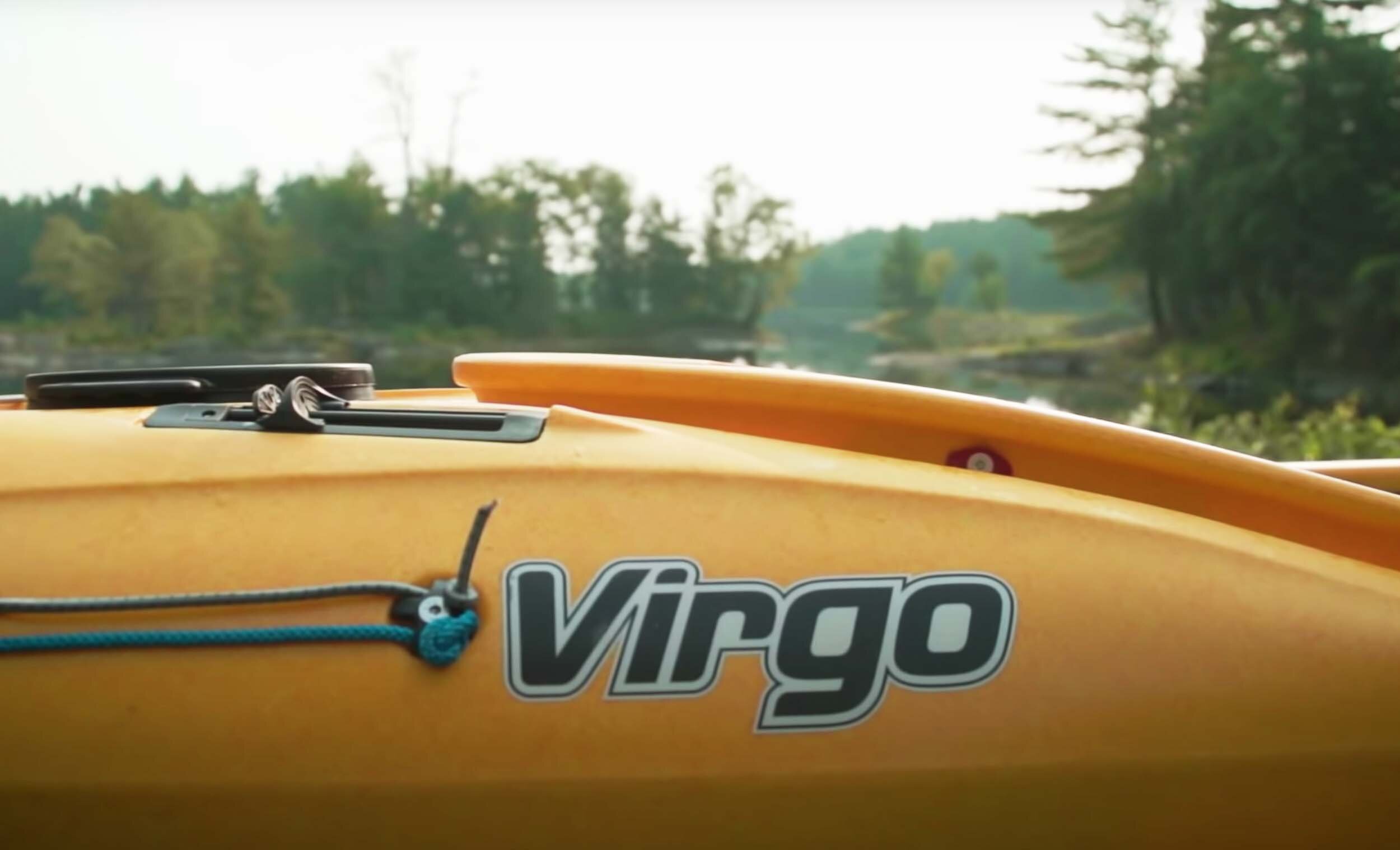 close up of the pandh virgo logo on a white kayak ken whiting paddletv