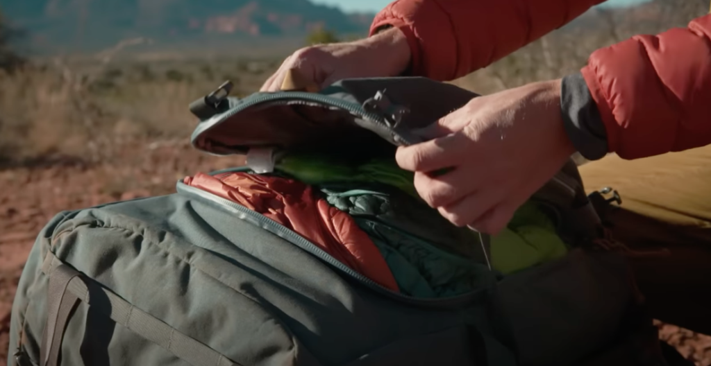 Terraframe 65L backpack design includes pockets and zippers