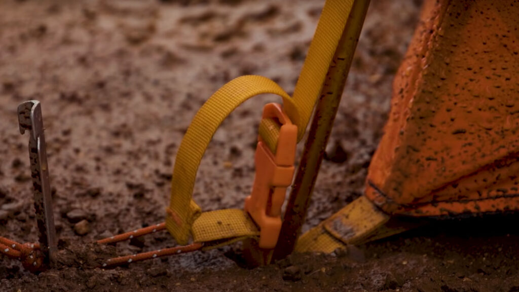 backpacking in the rain tip: staking in the rain can be challenging, use good tent stakes or use rocks to hold down stakes