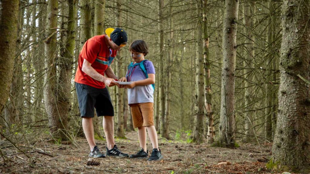 Top 5 Family Things To Do: Hiking! Nick and Tucker making sure we are still headed up the right trail.