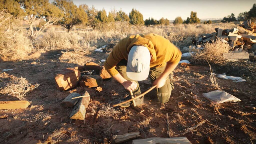 How to Start a Fire in the Wild with Sticks Tip: Get the proper body position set up for comfort and effectiveness.  The next step is a bit of work.
