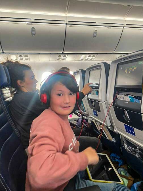 Mom, Dad, son and daughter are always ready with their form of in-flight entertainment.