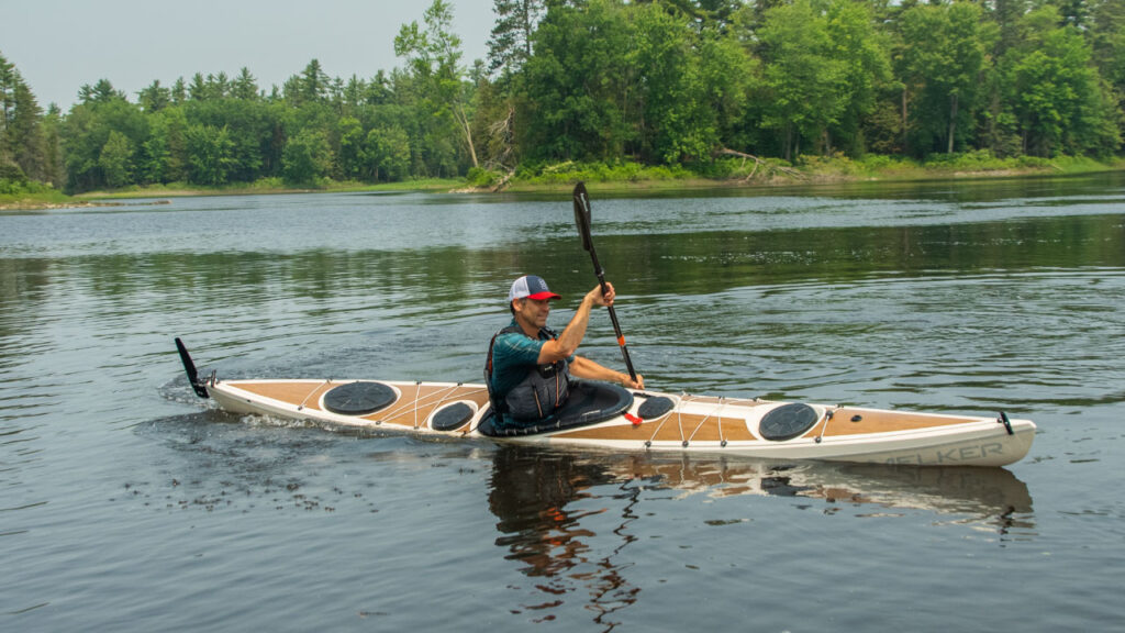 This boat has a drop down skeg to keep it straight. With the skeg up, it turns well.
