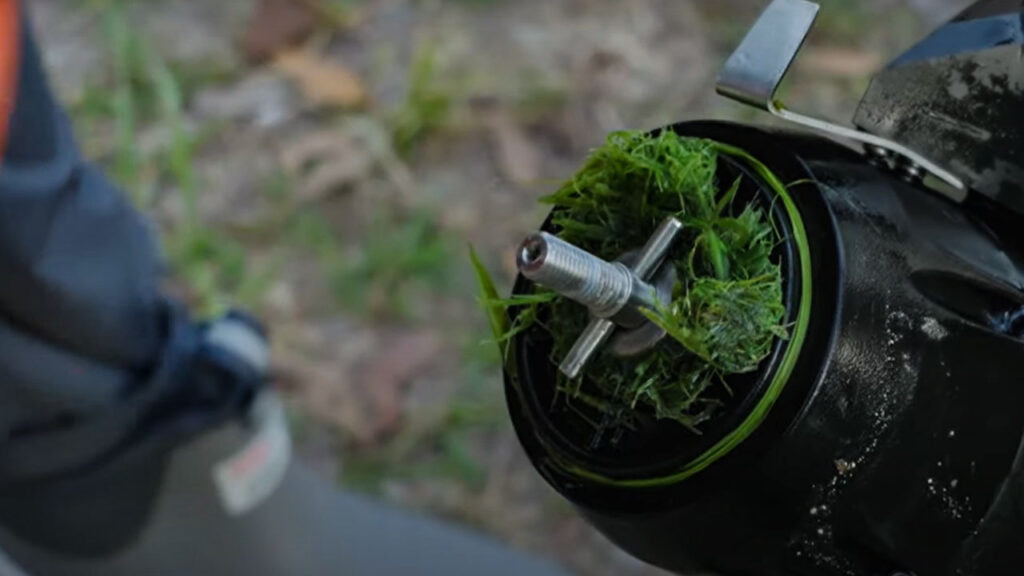 A quick un screwing of the cap and you can get at any excess grass trapped and slowing you down.