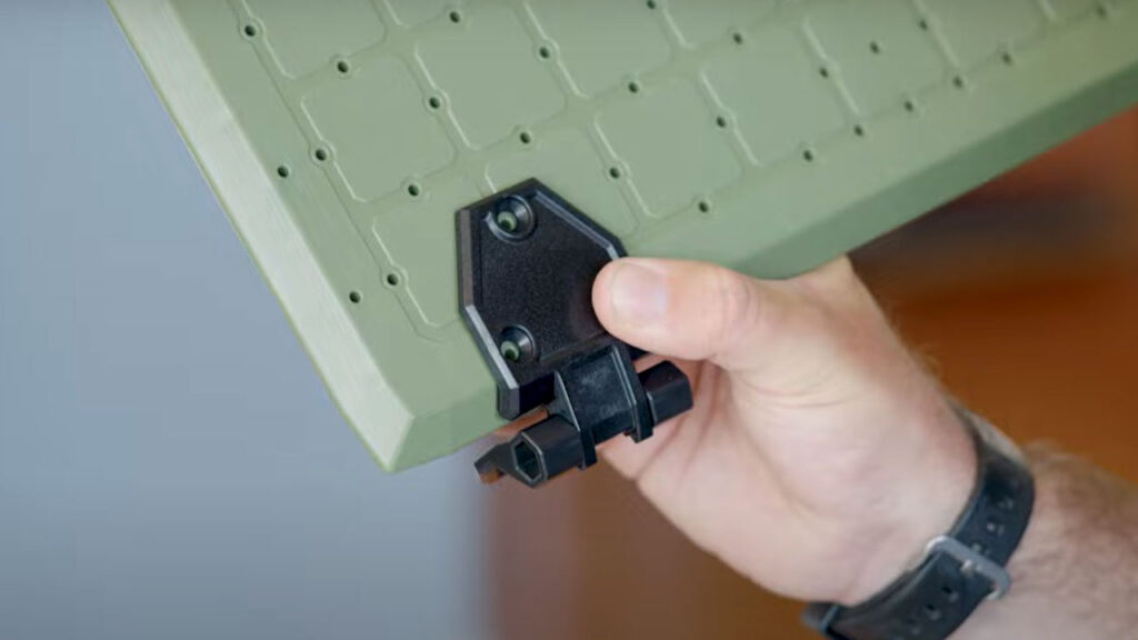 Line up the hinges in the pre-drilled holes.