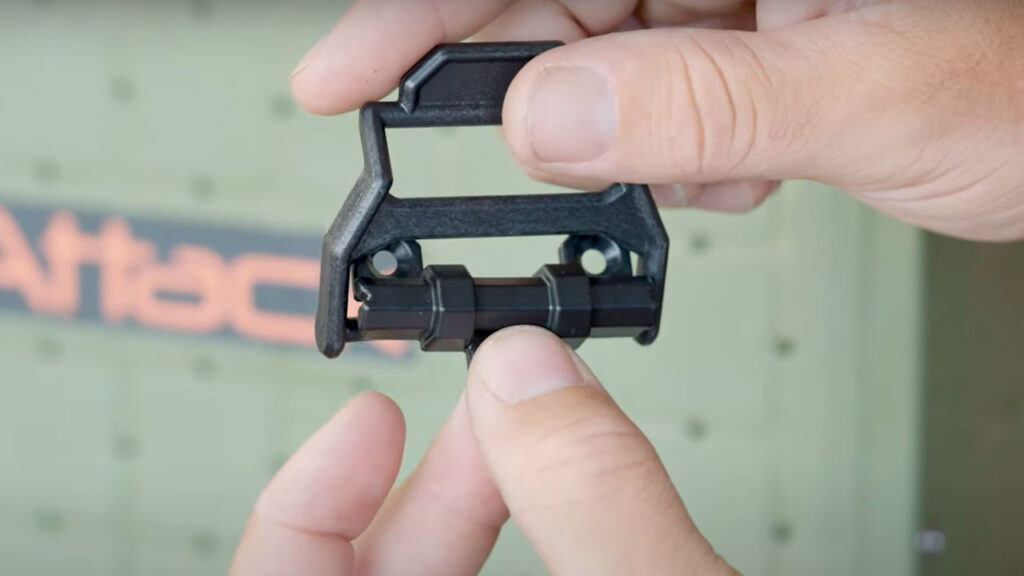 Sliding the screw holes kind of underneath like this to snap in works best.