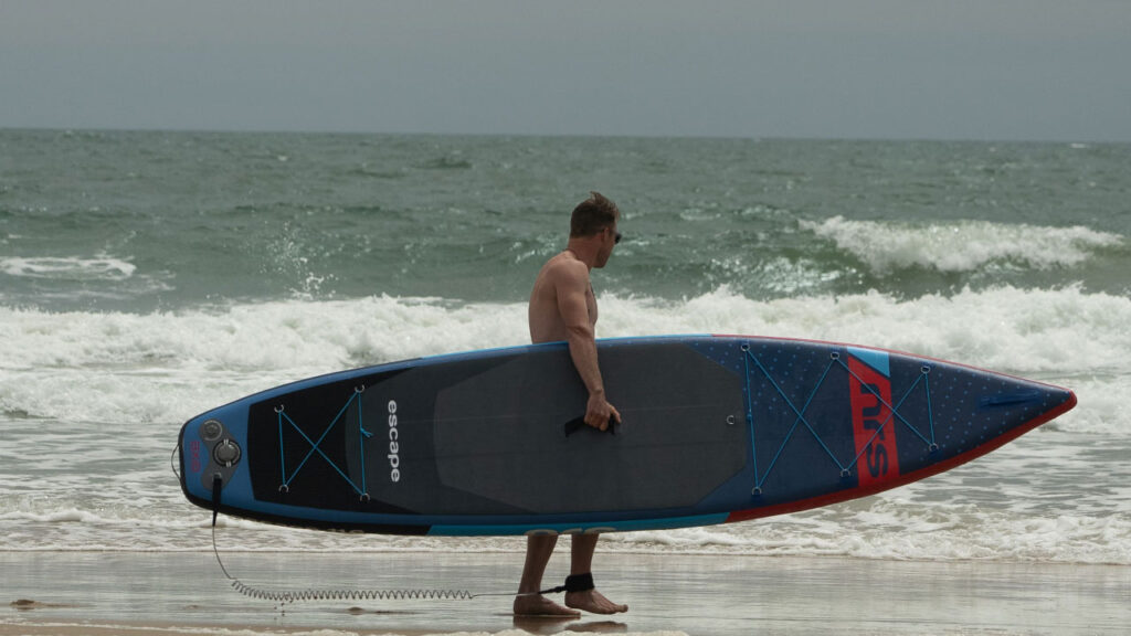 Nick slips off to surf it up while I do some home schooling, mental health of parents is important, and exercise helps