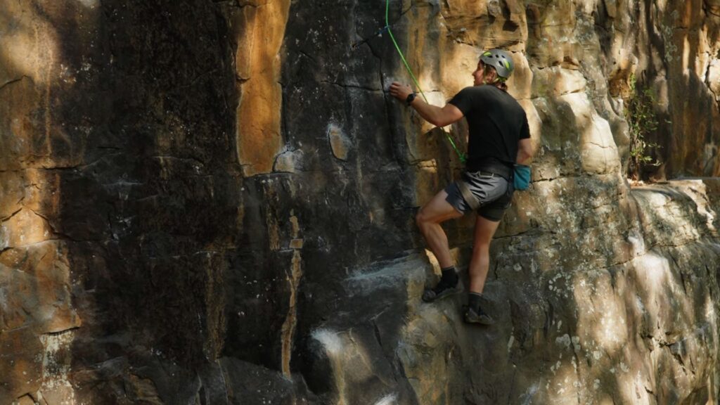 arkansas hiking, mike climbing rock face