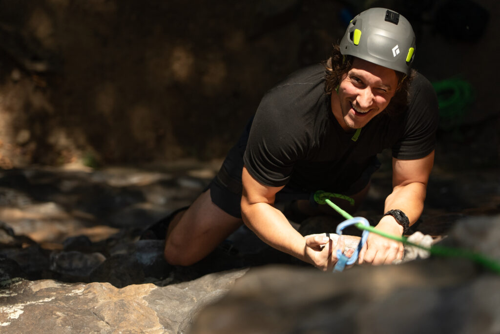 arkansas hiking, mike climbing rock face