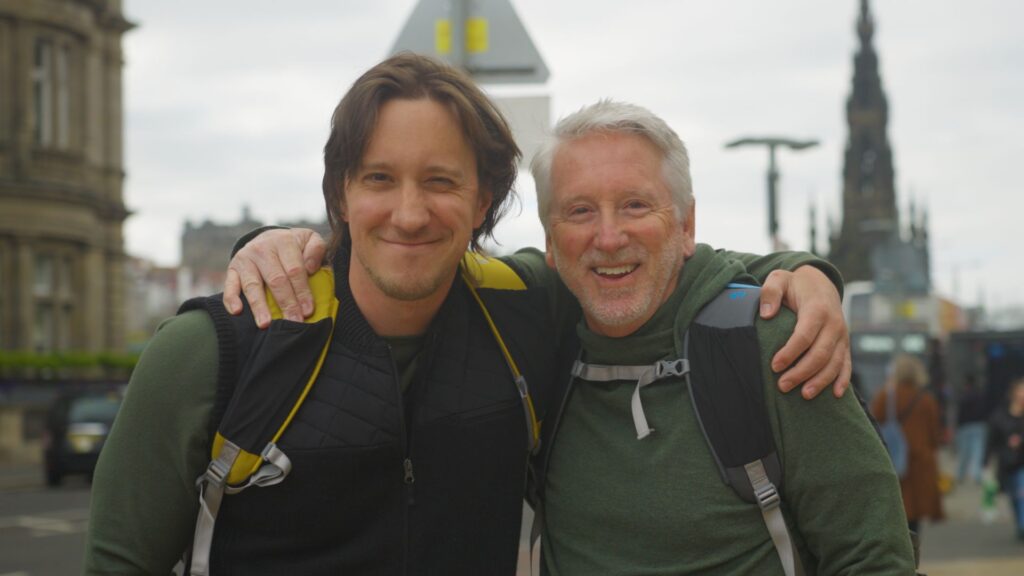 family travel insurance: mike and his dad smiling for camera, scotland